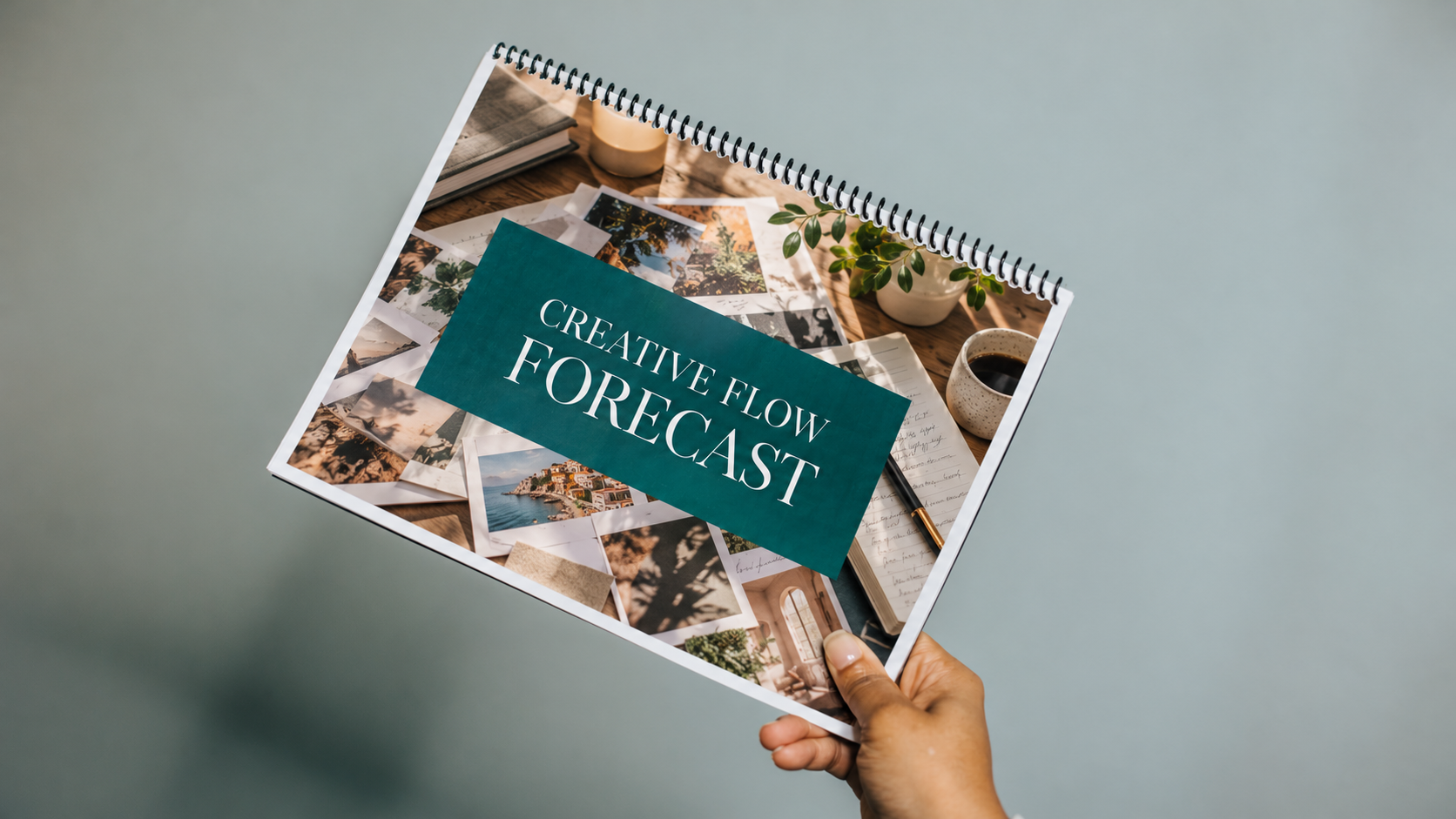 The Creative Flow Forecast planner held in hand